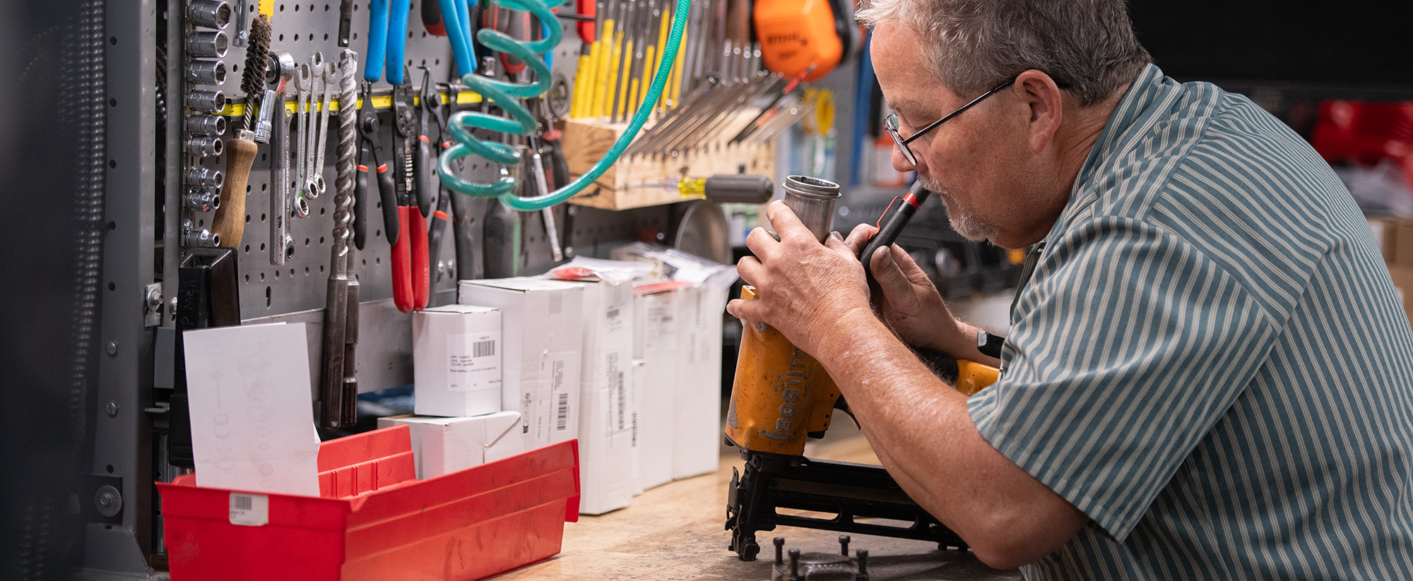 A PaulB service technician repairing a power tool